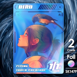 Könnte beinhalten: Eine weiße Keramik-Tasse mit schwarzem Henkel und dem Text "But First, Coffee" in fetter, schwarzer Schrift. Die Tasse steht vor einem verschwommenen Hintergrund, der eine gemütliche Umgebung suggeriert.