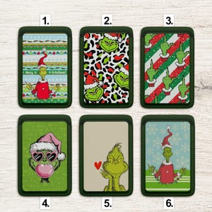May include: A collection of six green cardholders featuring Grinch-themed designs. The designs include the Grinch in a Santa hat, leopard print Grinch faces, and Grinch characters with various expressions. Some cardholders have text that reads "Merry Grinchmas!"