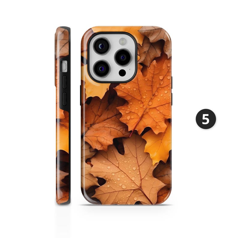 May include: A phone case featuring a design of autumn leaves in shades of brown and orange, with water droplets visible on the leaves. The case has a glossy finish and a black border. The number 5 is visible on the right side.