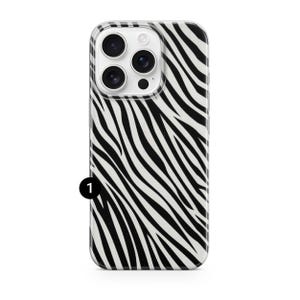 May include: A clear phone case with a black and white zebra stripe pattern. The case has a camera cutout and is designed to fit a smartphone. The case is made of a durable material and provides protection for the phone.