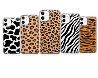 May include: Five phone cases with animal print designs. The cases feature cow, leopard, zebra, and tiger patterns. The cases are in a row, showcasing the variety of designs available.