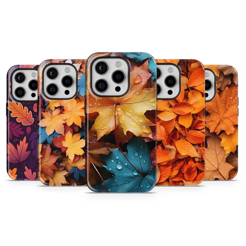 May include: A collection of five phone cases featuring vibrant autumn leaf designs. The cases showcase a variety of colorful leaves, including shades of red, orange, yellow, and blue, with water droplets visible on some leaves.