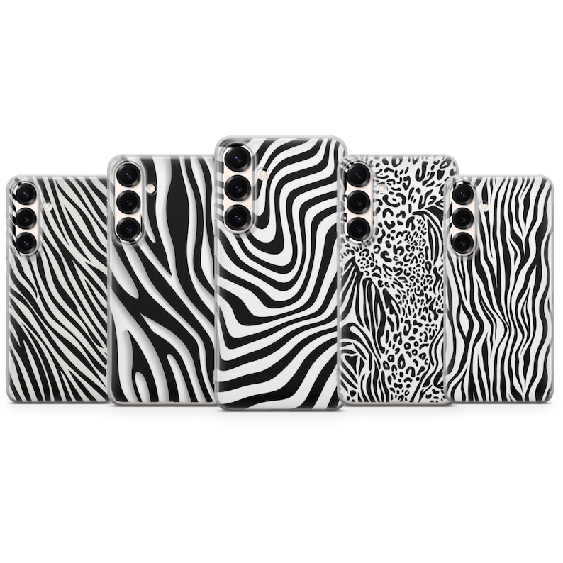 May include: A collection of five phone cases with animal print designs. The cases feature zebra stripes and leopard spots in black and white. Each case has a camera cutout and button placements.
