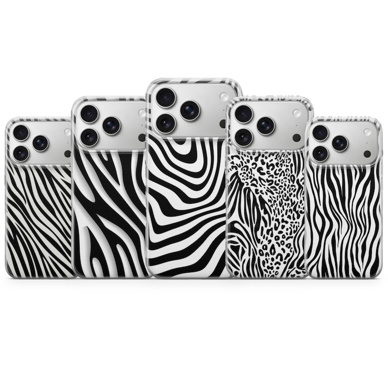 May include: A collection of five smartphone cases with a variety of animal print designs. The cases feature a clear border and a black and white zebra pattern, with one case showcasing a leopard print.