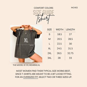 May include: Size chart for a t-shirt in inches. The chart shows the width and length of the shirt in sizes S, M, L, XL, 2XL, and 3XL. The model is wearing a size XL.