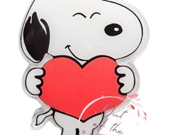 May include: A white cartoon dog with black ears holding a red heart. The dog is smiling and has a winking eye.