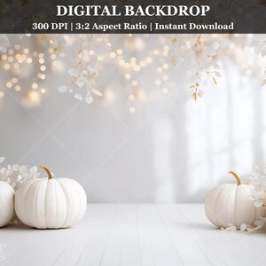 May include: A digital backdrop featuring white pumpkins with gold stems on a white wooden surface. The backdrop includes white foliage, soft bokeh lights, and the text "DIGITAL BACKDROP".