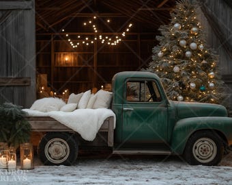 May include: A classic green pickup truck with a wooden bed, decorated for Christmas. The bed has white pillows and a fluffy blanket. A decorated Christmas tree and lit candles are in the background.