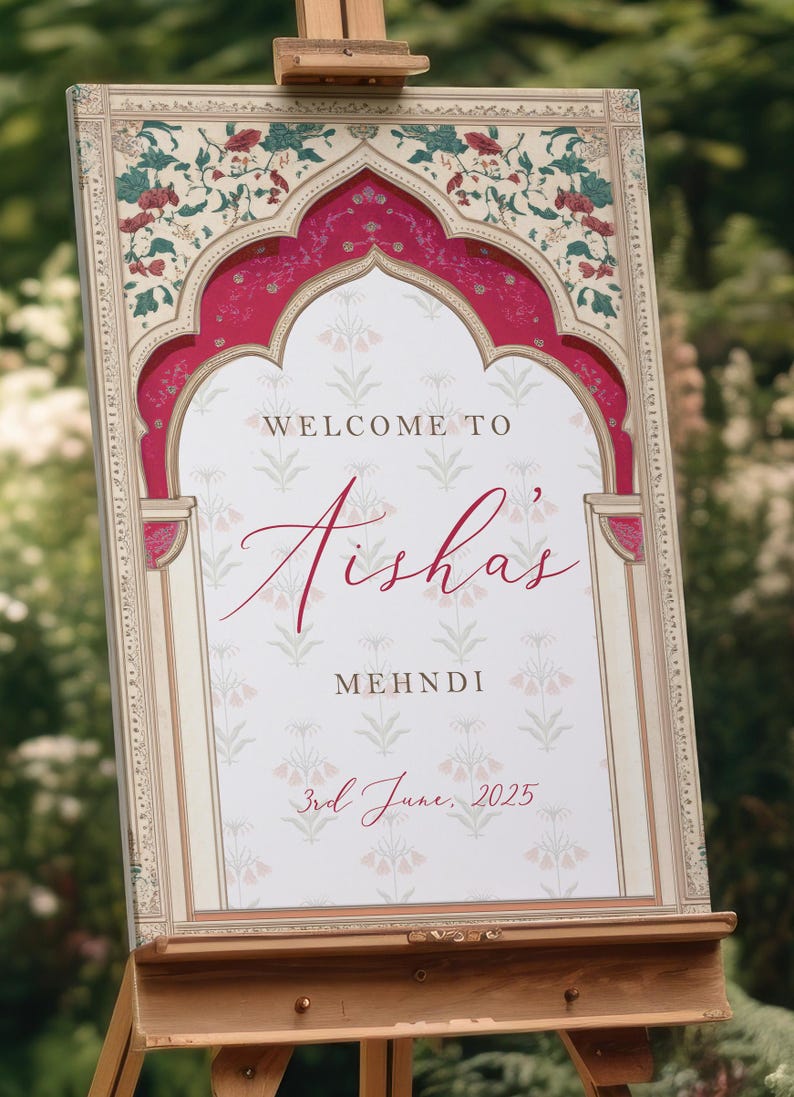Peut inclure: Panneau d&eacute;coratif sur chevalet avec un motif floral et l'inscription "Welcome to Aisha's Mehndi" en &eacute;criture &eacute;l&eacute;gante. Le panneau est encadr&eacute; d'une bordure rouge et cr&egrave;me, et la date "3rd June, 2025" est affich&eacute;e en bas.
