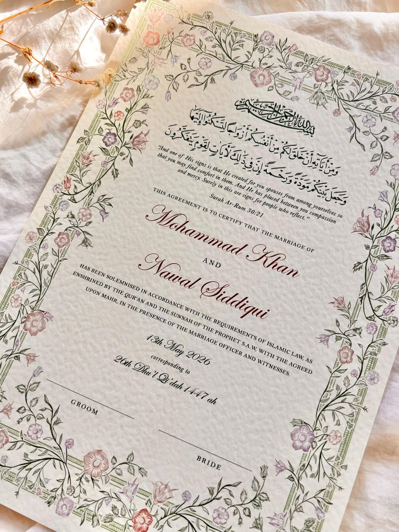 May include: A cream-colored Islamic marriage certificate featuring a floral border with pink and purple flowers. The document includes Arabic calligraphy, the English translation of Surah Ar-Rum 30:21, and the names Mohammad Khan and Nawal Siddiqui.