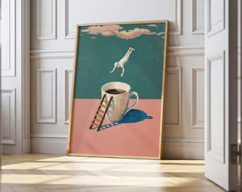 May include: A framed art print depicts a surreal scene of a person diving into a coffee-filled mug. The artwork features a ladder, a blue shadow, and a pink and teal background. The print is displayed in a room with white paneling and a wooden floor.