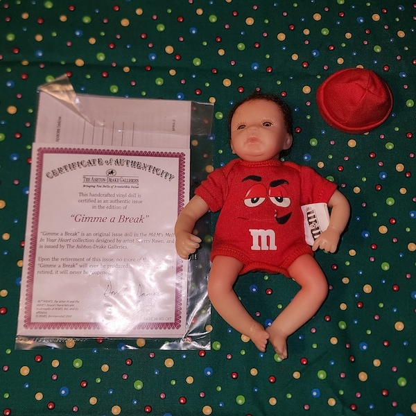 Ashton-Drake "Gimme A Break" M & M Doll Red Outfit with Dark Hair Tiny Matching Hat Long Eyelashes Candy Doll Poseable Doll with Certificate