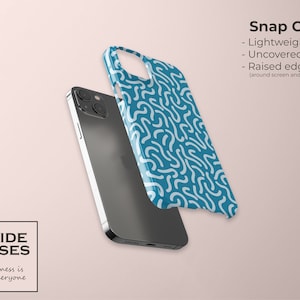May include: A teal blue phone case with a white abstract pattern. The case is shown with a black phone. The text "Snap Case" is written in black text above the phone case. The text "Lightweight & Slim" is written in black text below the phone case. The text "Uncovered Buttons" is written in black text below the text "Lightweight & Slim". The text "Raised edges" is written in black text below the text "Uncovered Buttons". The text "(around screen and camera)" is written in black text below the text "Raised edges".