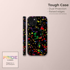 May include: A black phone case with a rainbow splatter pattern. The case has raised edges to protect the screen and camera. The text "PRIDE CASES" and "Happiness is for Everyone" is printed on the bottom left corner of the image.