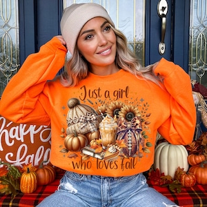 May include: Orange sweatshirt with the text "Just a girl who loves fall" and a graphic of a pumpkin, a coffee cup, a football, and a sunflower.