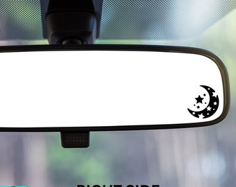 May include: A black car rearview mirror with a crescent moon and stars sticker on the right side. The text "RIGHT SIDE" is printed below the mirror.