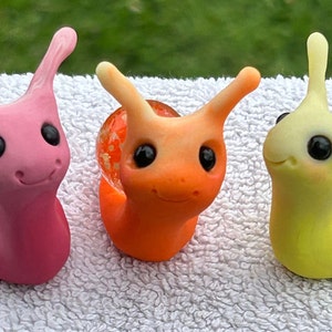 Whimsical happy marble snails with glow in the dark sparkles - fairy garden -