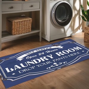 May include: Blue and white laundry room rug with the text "Self-Service Open 24 Hours Laundry Room Drop Your Pants Here".