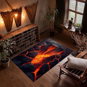 Puede incluir: Una alfombra negra y naranja con un diseño de lava que fluye a través de roca agrietada.