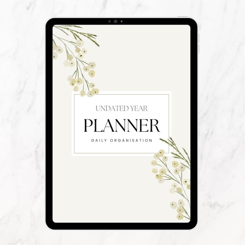 Puede incluir: Un planificador digital en una tableta con las palabras "UNDATED YEAR PLANNER DAILY ORGANISATION". El planificador tiene un fondo color crema con detalles florales y un borde negro.