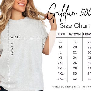 May include: A light gray Gildan 5000 t-shirt with a size chart. The chart shows measurements in inches for sizes S to 5XL, with widths ranging from 18 to 32 inches and lengths from 28 to 35 inches.