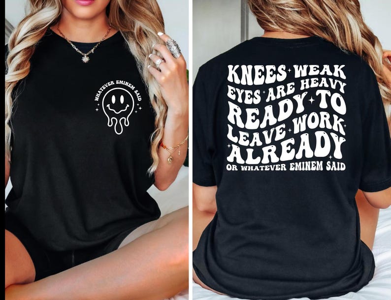 May include: Black t-shirt with a white graphic on the front of a melting smiley face and the text "WHATEVER EMINEM SAID". The back of the shirt has the text "KNEES WEAK EYES ARE HEAVY READY TO LEAVE WORK ALREADY OR WHATEVER EMINEM SAID".