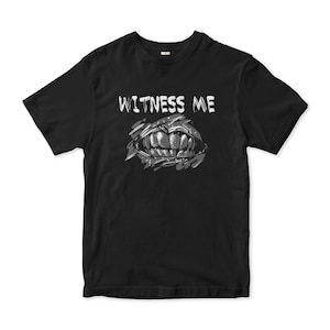 May include: Black t-shirt with a white graphic of a mouth with teeth and the text "WITNESS ME".