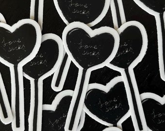 Love Sucks Lolli Sticker | black and white 2-inch sticker | valentines | anti valentines