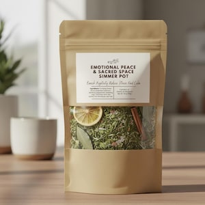 May include: A kraft paper bag with a clear window displaying a simmer pot blend. The label reads "EMOTIONAL PEACE & SACRED SPACE SIMMER POT". Ingredients include lemon slices, cinnamon sticks, and herbs. The product aims to banish negativity and reduce stress.