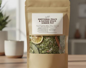 May include: A kraft paper bag with a clear window displaying a simmer pot blend. The label reads "EMOTIONAL PEACE & SACRED SPACE SIMMER POT". Ingredients include lemon slices, cinnamon sticks, and herbs. The product aims to banish negativity and reduce stress.