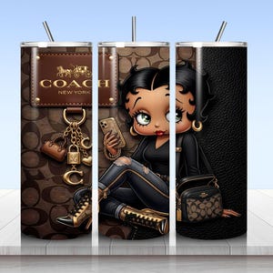 May include: A cylindrical tumbler with a straw featuring a brown monogram pattern, a Coach New York logo patch, and a cartoon character with black hair wearing a black top and ripped jeans, holding a phone and a small handbag with gold accents.