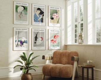 May include: Six framed prints of Japanese art hang on a white wall. The prints feature images of a crane, a woman with long hair, a lotus flower, a rooster, two goldfish, and a snowy scene. The prints are all in a similar style and have a traditional Japanese aesthetic.