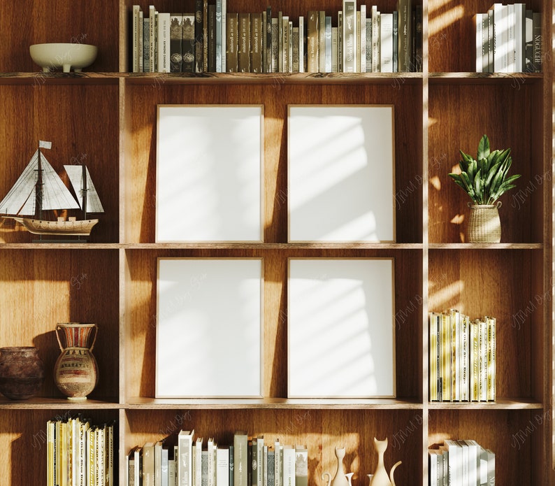 May include: A wooden bookcase with four empty picture frames, books, and decorative items. The bookcase is made of light brown wood and has a rustic look. The frames are all the same size and are arranged in a grid pattern. The books are stacked on the shelves and are of various sizes and colours. The decorative items include a small sailboat, a vase, and a potted plant.