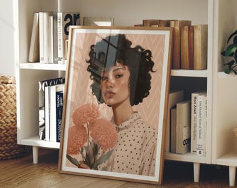 Puede incluir: Una impresión artística enmarcada que presenta un retrato de una persona con cabello rizado sosteniendo flores de color melocotón. La persona lleva una camisa de lunares. El fondo tiene un patrón geométrico rosa y blanco. El marco es de color marrón claro.