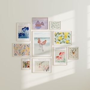 May include: A wall gallery featuring nine framed prints with various themes, including floral, animal, and abstract designs. The prints are arranged in a grid pattern and feature a variety of colours and styles.