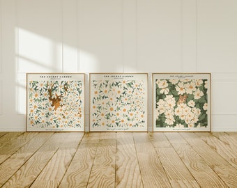 May include: Three framed prints with a white floral pattern and green foliage. The prints have the text "The Secret Garden" and "You've got a secret of gold" on them.
