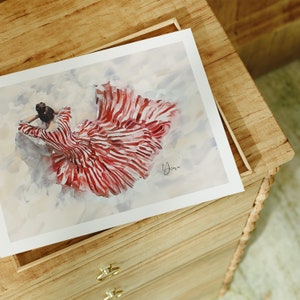 May include: A watercolor painting of a woman wearing a red and white striped dress. The woman is lying on her side with her head resting on her arm. The painting is on a wooden frame.