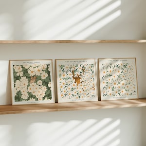 May include: Three framed prints with white flowers and green leaves. The prints have the text "The Secret Garden" and "You've got a heart of gold" on them.