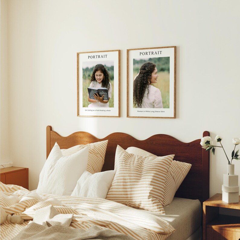 May include: Two framed photographs of portraits, each with the word "PORTRAIT" at the top. The photo on the left shows a young person sitting on a chair reading a book. The photo on the right shows a person with long hair standing in front of a green background. Both photos are displayed on a white wall above a wooden headboard with a striped pillow.
