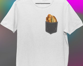 May include: White t-shirt with a black pocket. A fried chicken sandwich is in the pocket.