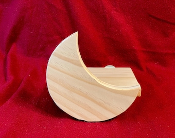 May include: A wooden crescent moon shaped box with a natural wood finish. The box is open and the inside is visible.