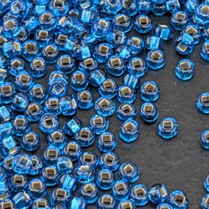 Transparent Aqua Blue Silver-Lined 10/0 15g pkg