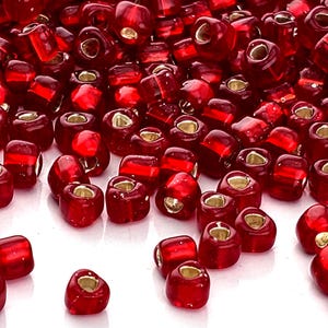 Dark Red Translucent Silver Lined Miyuki Triangle Size  10/0 (15g Pkg)