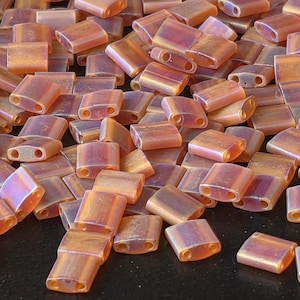 TL0134FR-Miyuki Tila Beads:Dark Amber T/MA/R (7.5g pkg)