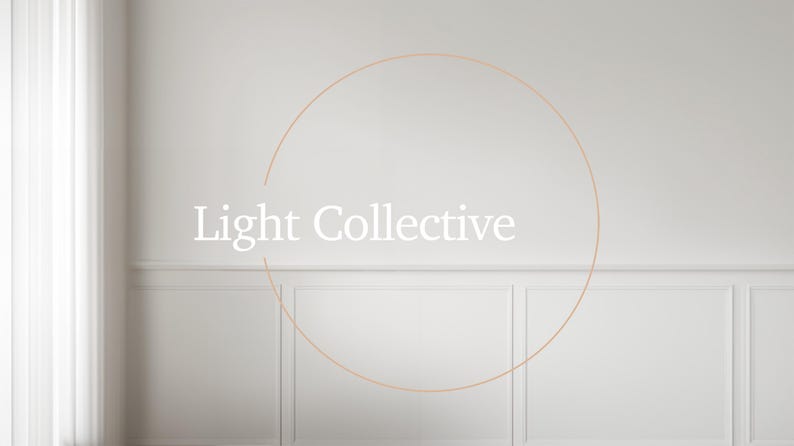 May include: A white wall with a light brown circle and the text "Light Collective" in the center.