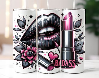 May include: Three stainless steel tumblers with a white background and black and pink graphic designs. The designs feature a pair of lips, a lipstick, and floral elements. The text "BADASS" is printed on one of the tumblers.