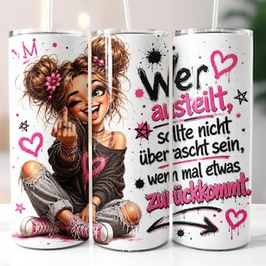 May include: A cylindrical white tumbler featuring a cartoon illustration of a person with messy buns, wearing a dark sweater and ripped jeans, giving a middle finger gesture. The design includes pink hearts, stars, and German text in black and pink.