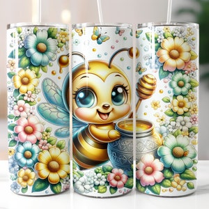 May include: Three stainless steel tumblers with a white background and a cartoon bee design. The bee is holding a honey pot and is surrounded by colourful flowers.