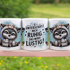 May include: Three white ceramic mugs with a wolf wearing a sheep costume. The mug on the left has a wolf with a blue background. The mug in the middle has the text "Unterschätz mich ruhig. Das wird lustig!" The mug on the right has a wolf with a blue background.