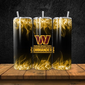 May include: Three stainless steel tumblers with a black background and yellow flames. The tumblers have the Washington Commanders logo and the words "Washington Commanders".